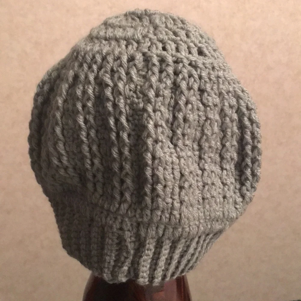 Handmade Crochet hat. Never worn. Grey in color.